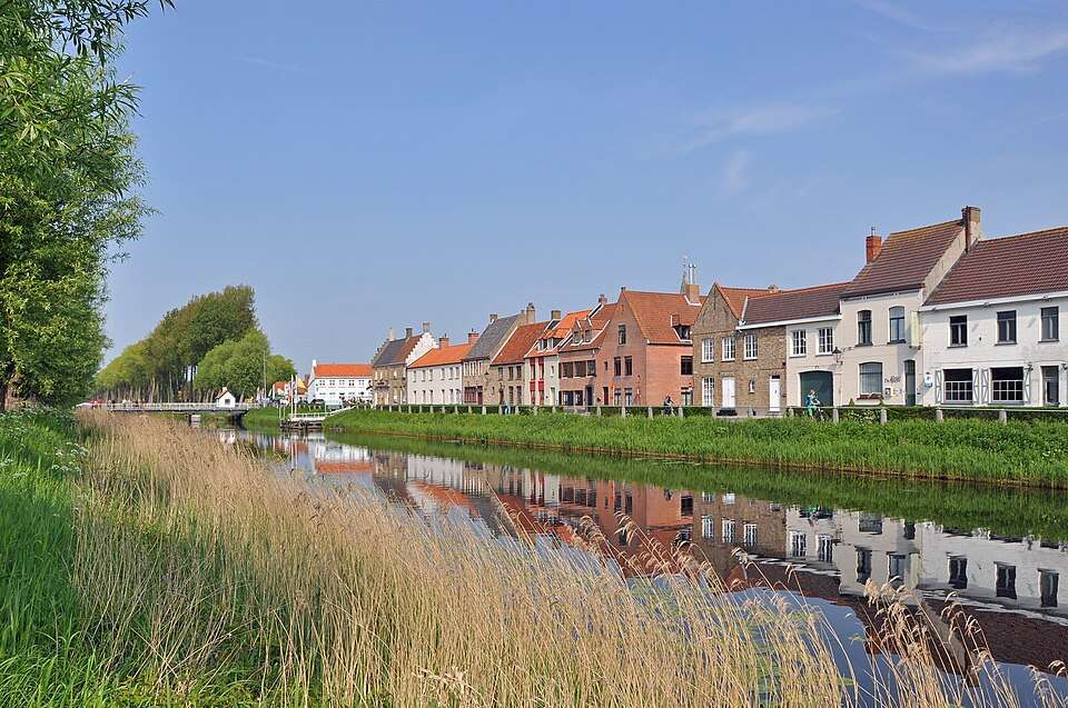 Canal houses reflected in the Damse Vaart, Damme